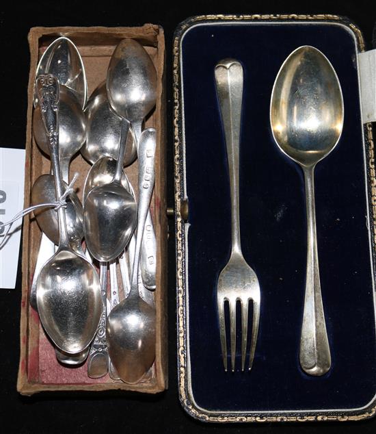 A cased silver christening pair and thirteen assorted silver tea and coffee spoons.